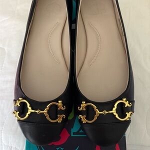 C. Wonder Black Flats with Gold Detailing